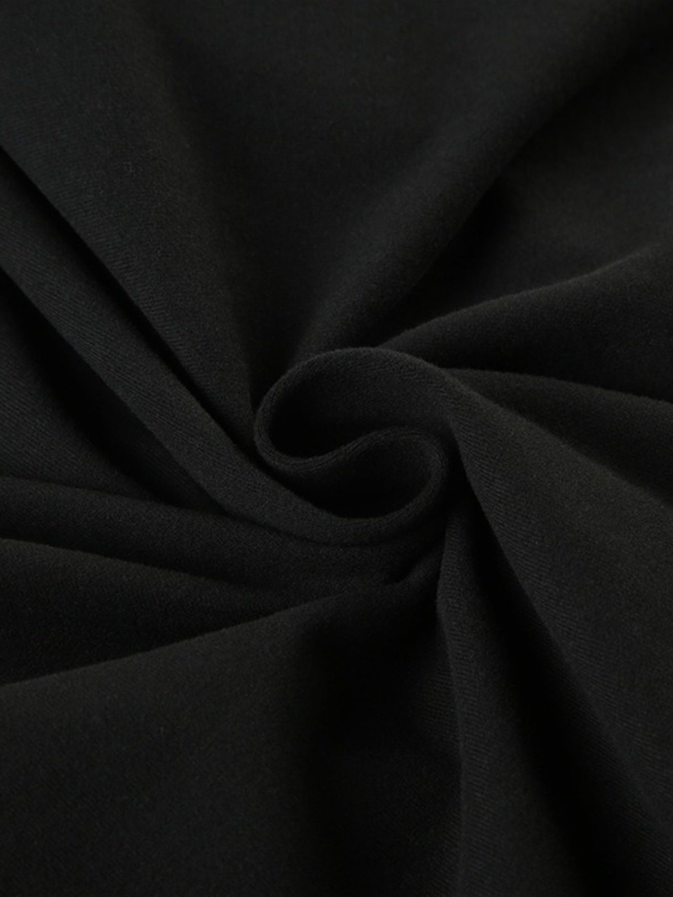 Close-up of black fabric with folds