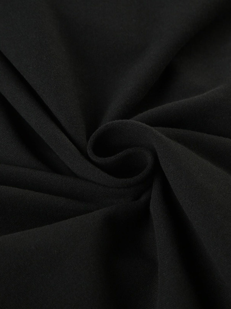 Close-up of black fabric with folds