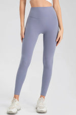 Person wearing light purple leggings on a white background