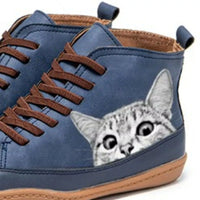 Blue shoe with a cat design on a white background