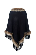 Black poncho with fur trim on a white background