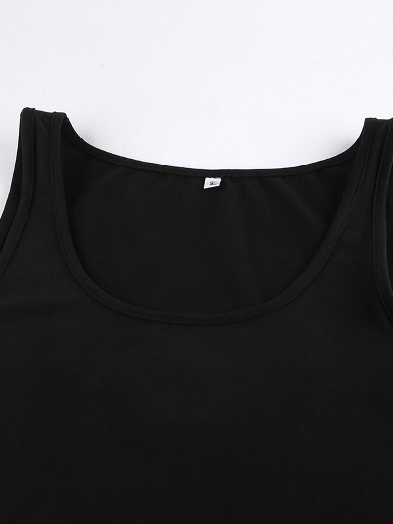 Close-up of a black tank top with a brand label on a white background