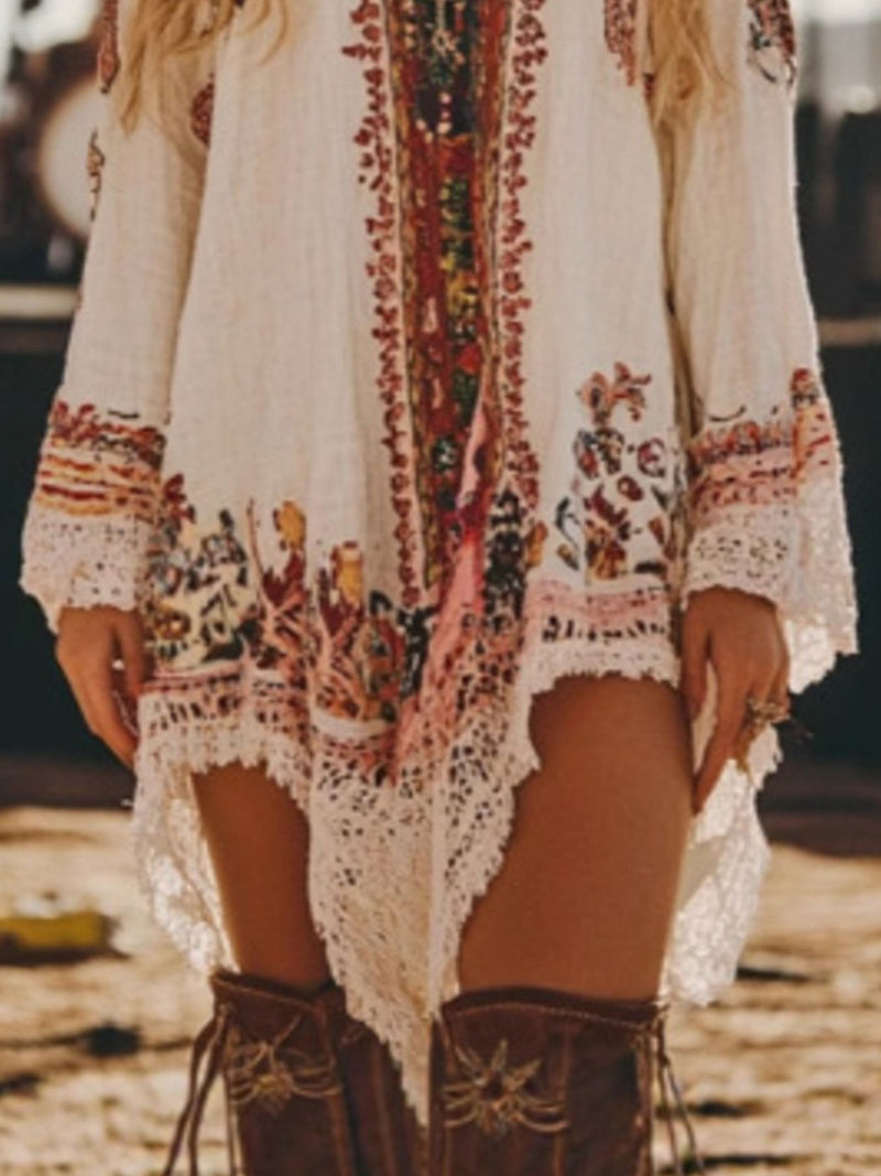 Person wearing a bohemian-style dress with intricate patterns and brown boots on a blurred background