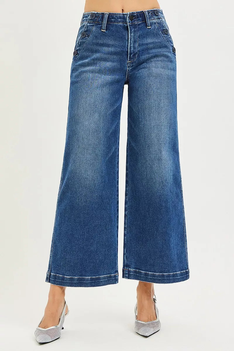 Wide-leg jeans worn by a person on a light gray background