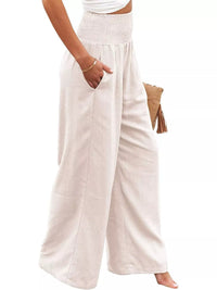 Person wearing white wide-leg pants on a white background