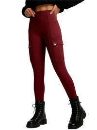 Maroon leggings with pocket details worn by a person on a white background