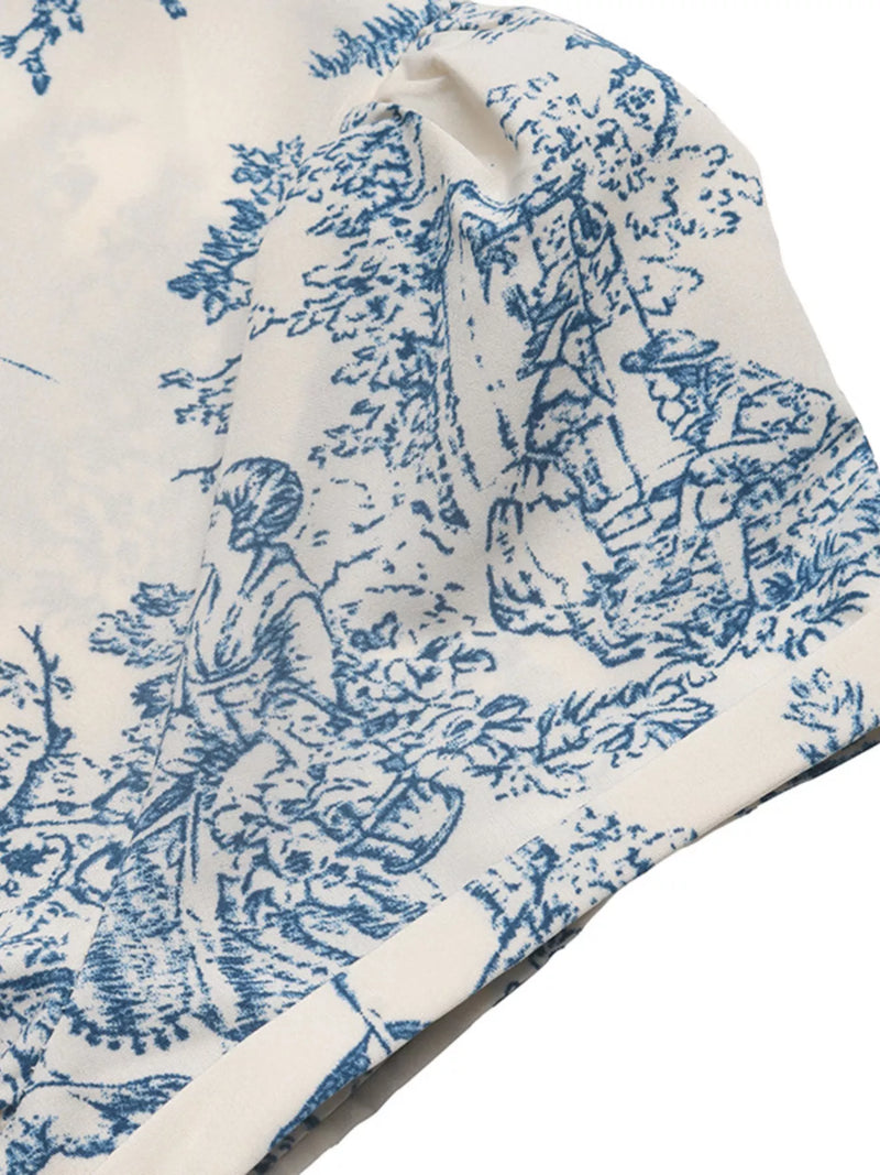 Blue and white toile pattern on a fabric swatch
