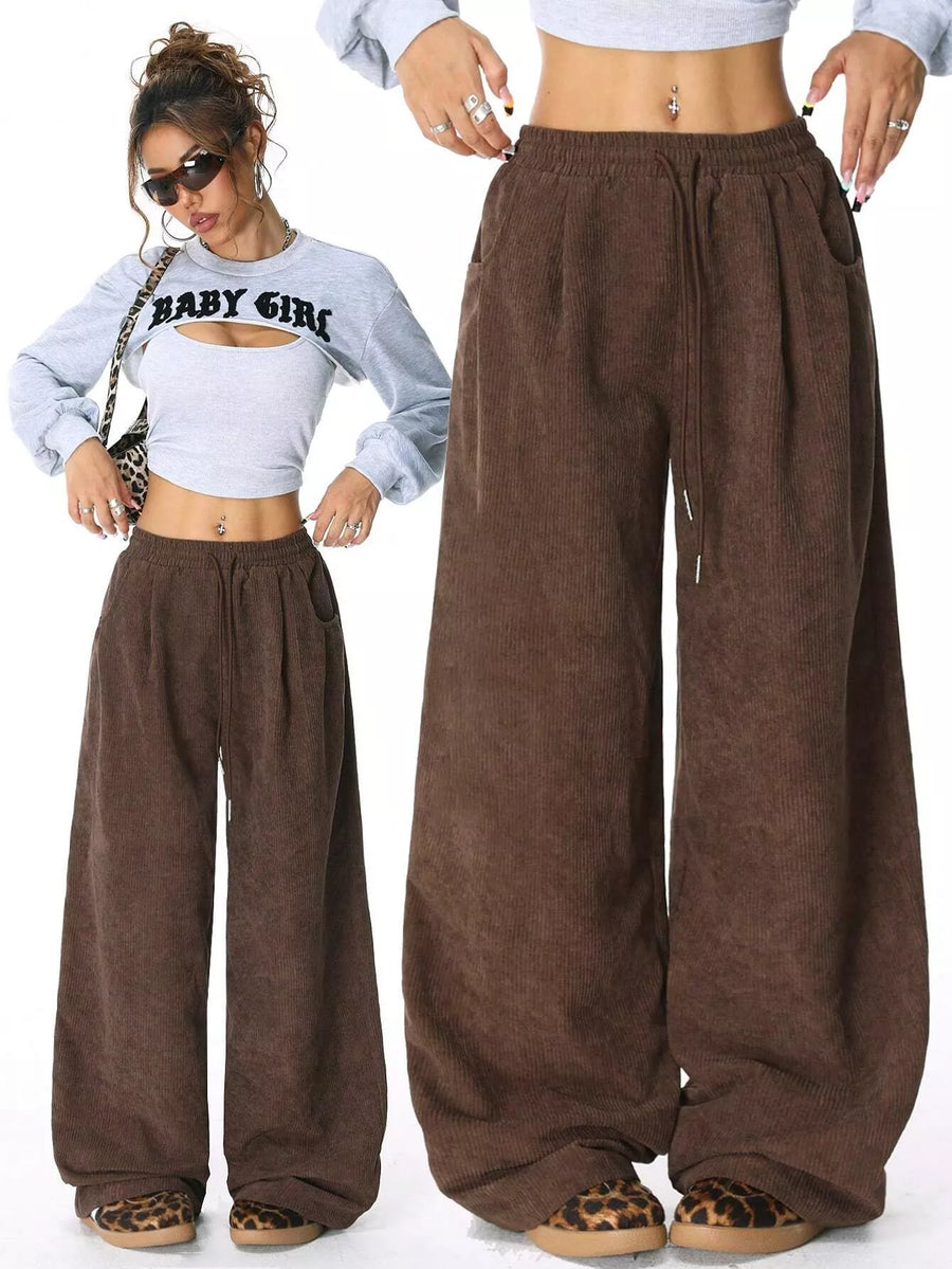 Brown wide-leg pants worn by a person on a white background