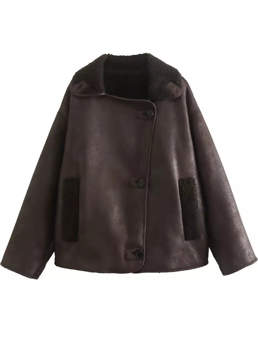 A dark brown faux-leather jacket with a plush dark brown shearling-style collar and matching dark brown patch pockets, shown against a plain white background.
