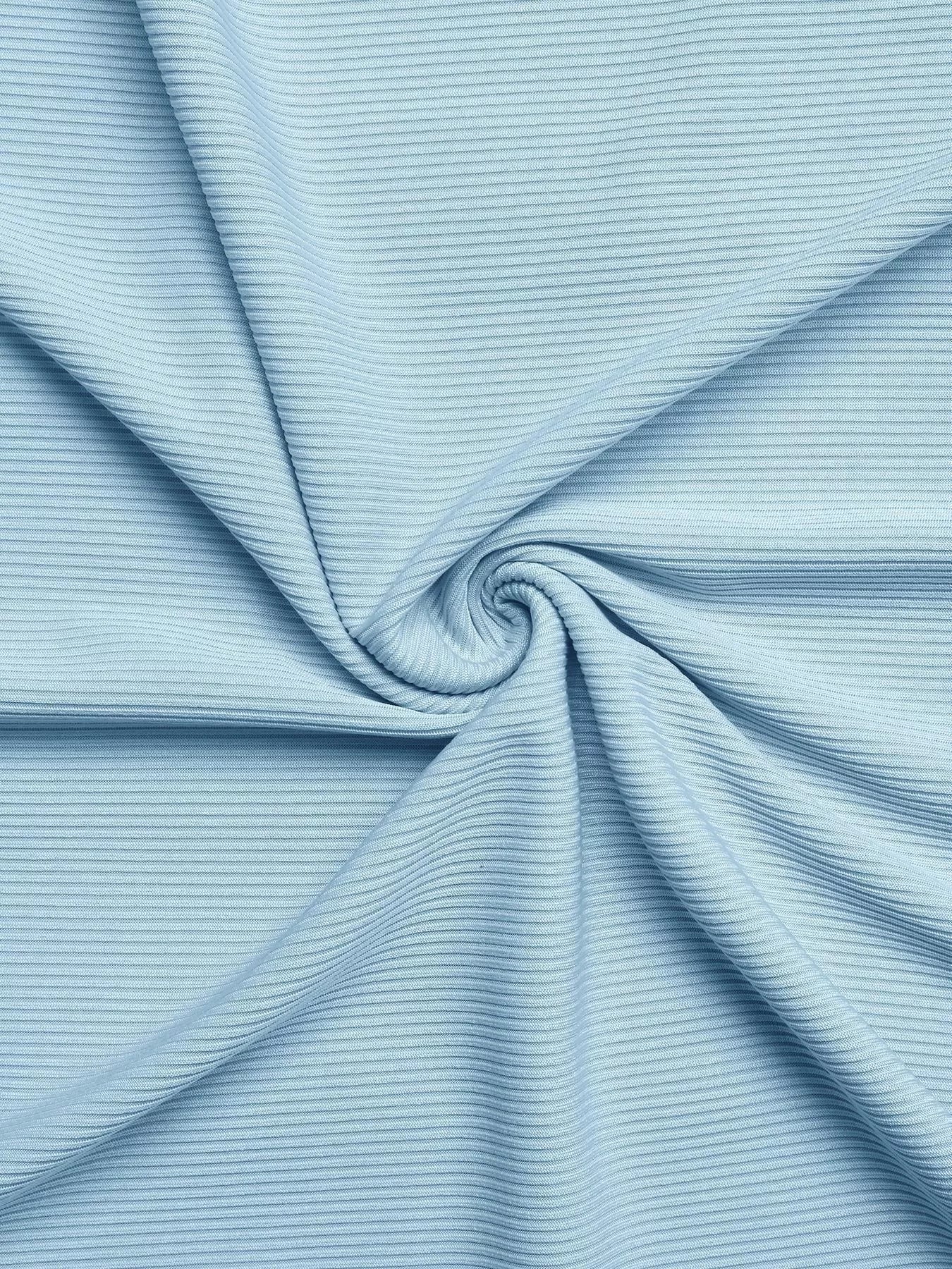 Close-up of light blue ribbed fabric with a swirl pattern