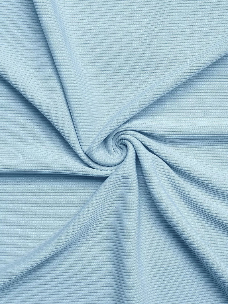 Close-up of light blue ribbed fabric with a swirl pattern