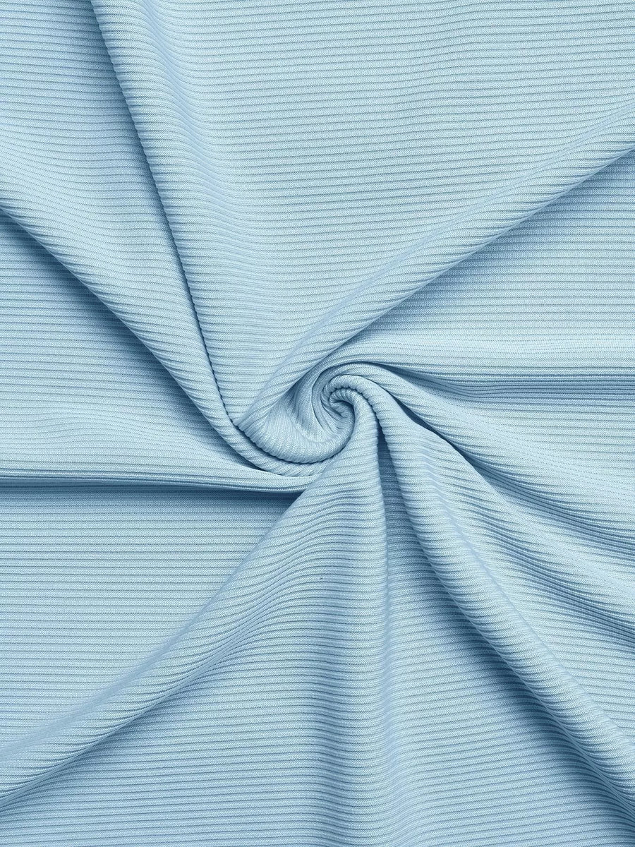 Close-up of light blue ribbed fabric with a swirl pattern