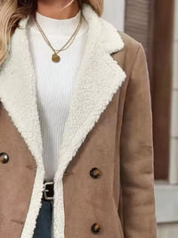Brown coat with white sherpa lining worn by a person.