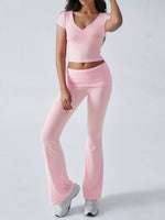 Person wearing a pink outfit on a white background