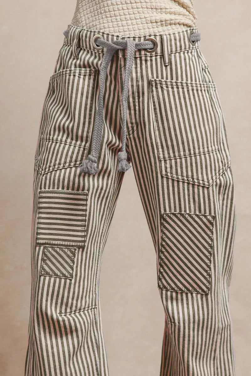 Striped pants with a drawstring on a beige background