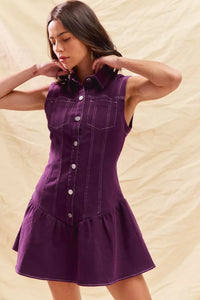 Woman wearing a purple dress with a beige background