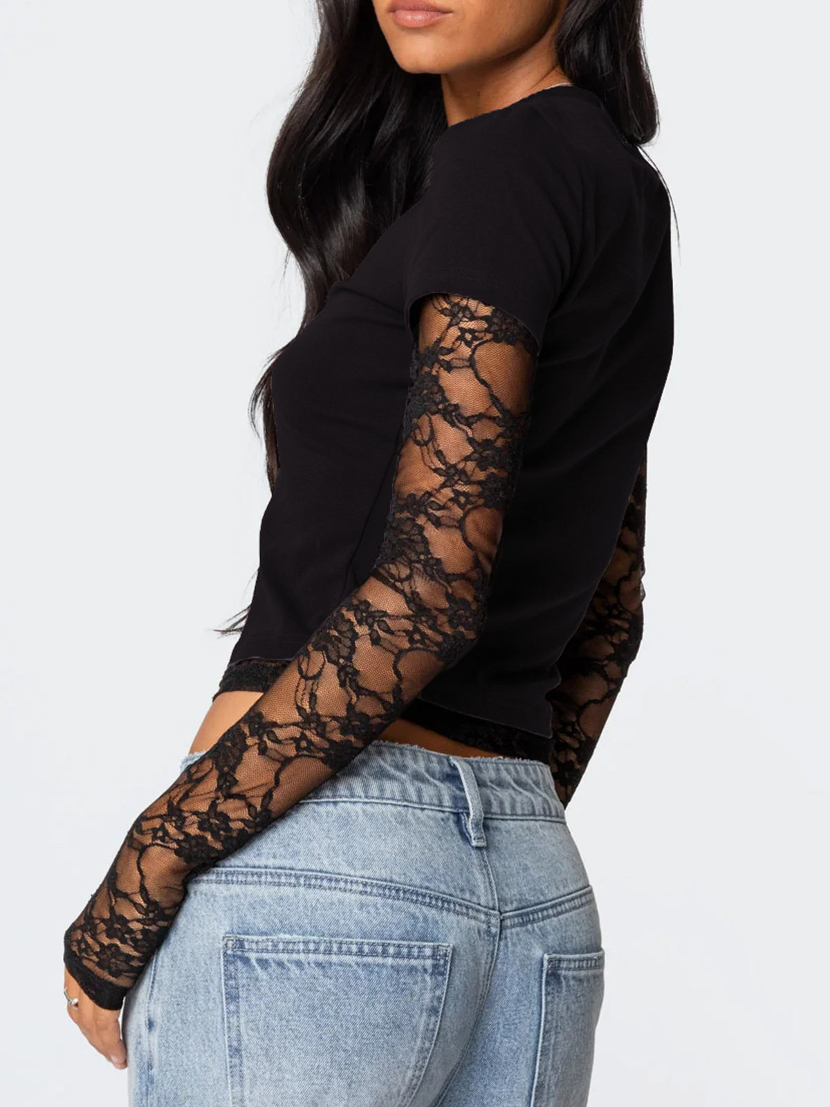 Black long-sleeve top with lace sleeves worn by a person on a white background