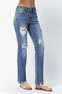 Ripped blue jeans on a white background