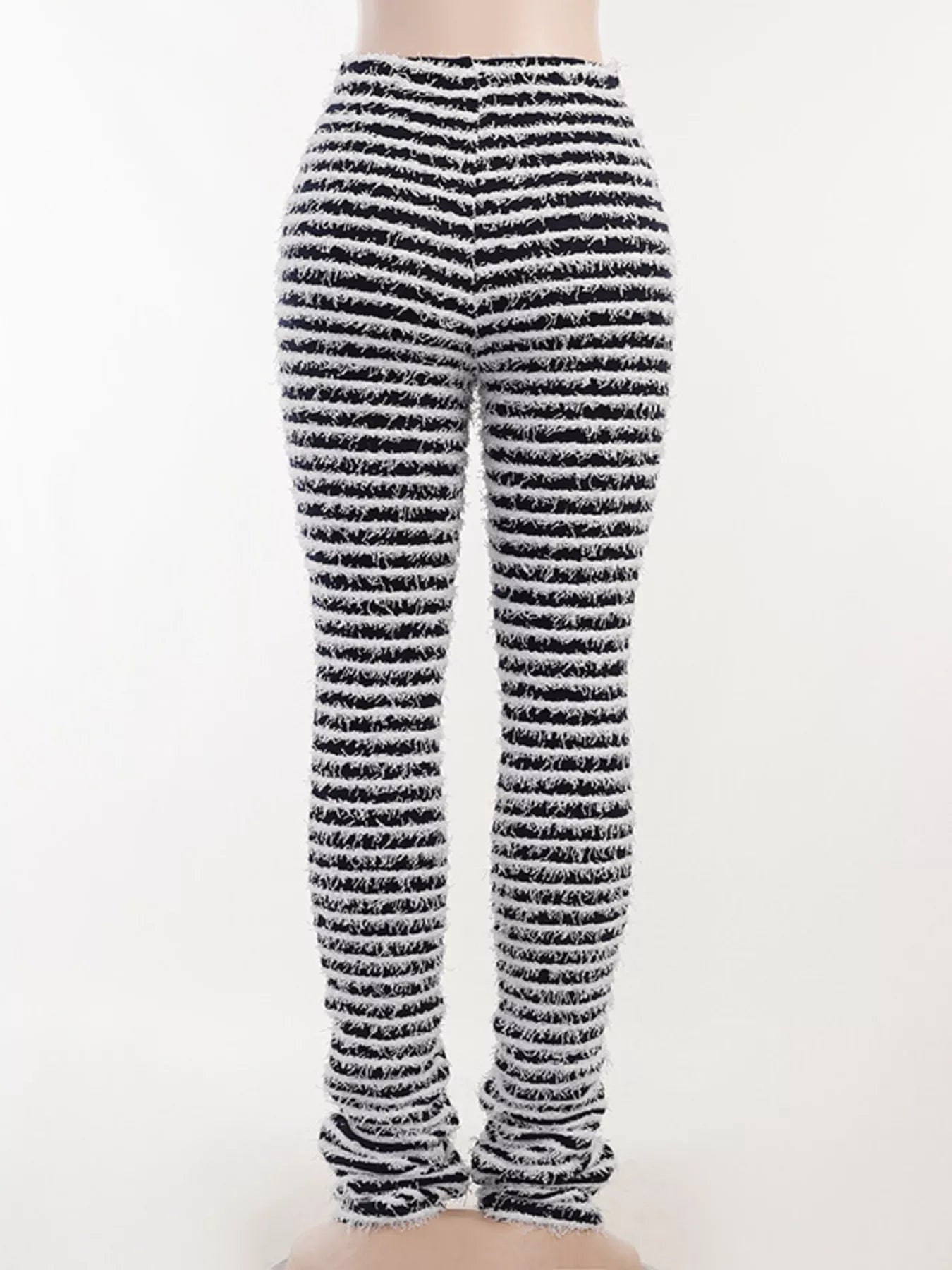 Black and white horizontally striped knit leggings shown on a model from the back, against a plain white background.
