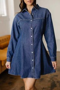 Woman wearing a denim dress with a blurred background