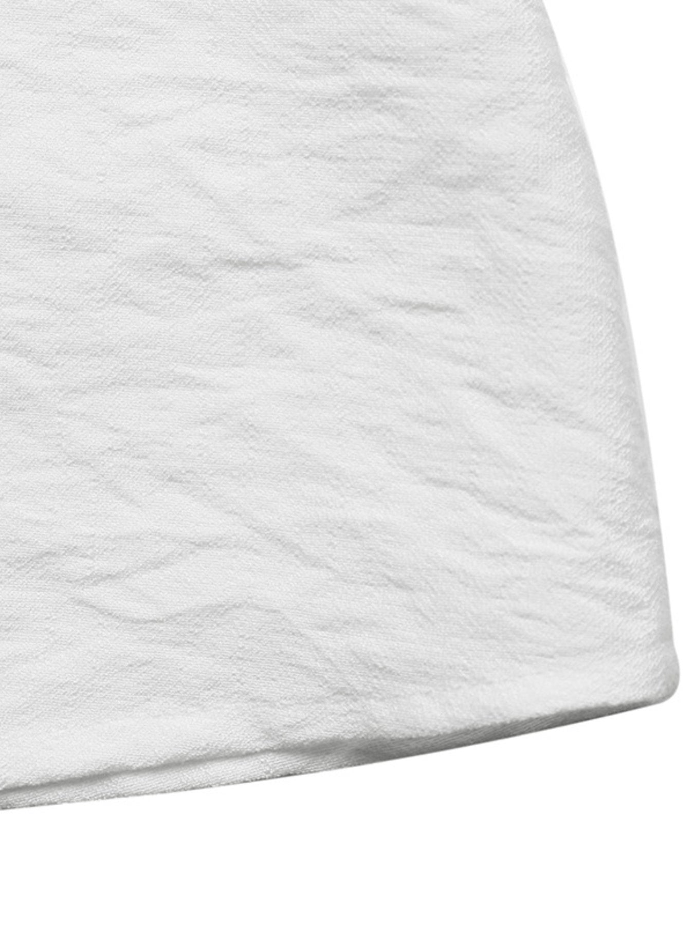 Close-up of a textured white fabric corner on a white background