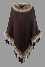 Brown poncho with fur trim on a gray background