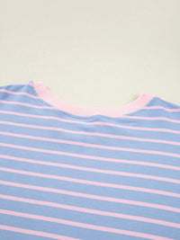 Close-up of a blue and pink striped fabric with a plain background