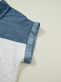Close-up of a blue and gray fabric edge on a beige background