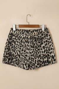 Leopard print shorts on a beige background