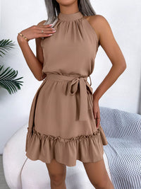 Woman wearing a brown dress with a white background