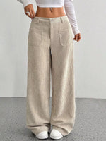 Beige corduroy wide-leg pants worn by a person on a plain background