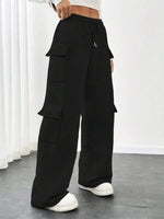 Black cargo pants worn by a person on a plain background