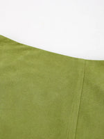 Close-up of a green fabric with a white background