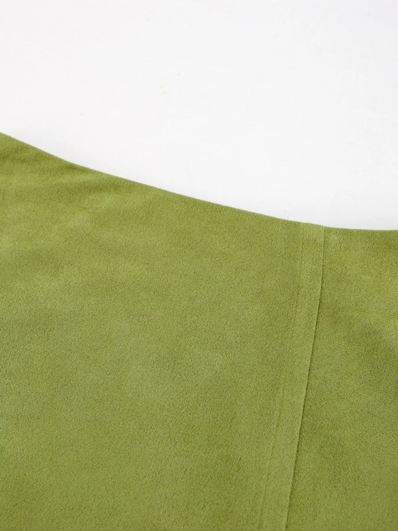 Close-up of a green fabric with a white background