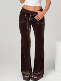 Brown velvet pants with a drawstring waist on a white background