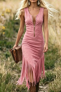 Woman wearing a pink fringe dress in a natural setting