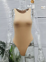 Beige swimsuit on a mannequin against a striped background