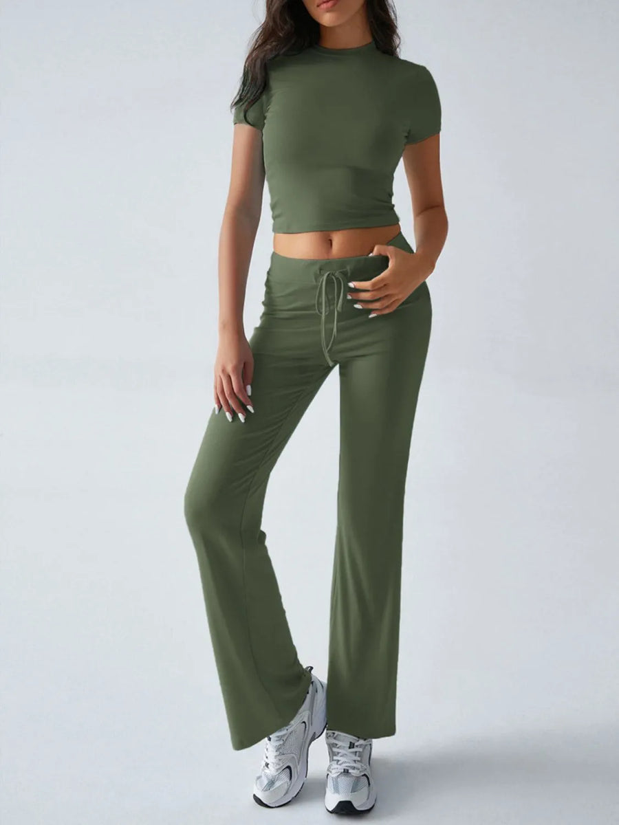 Person wearing a green athletic outfit on a white background