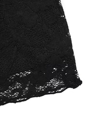 Close-up of black lace fabric on a white background