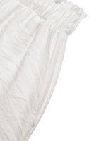 Close-up of textured white fabric on a white background