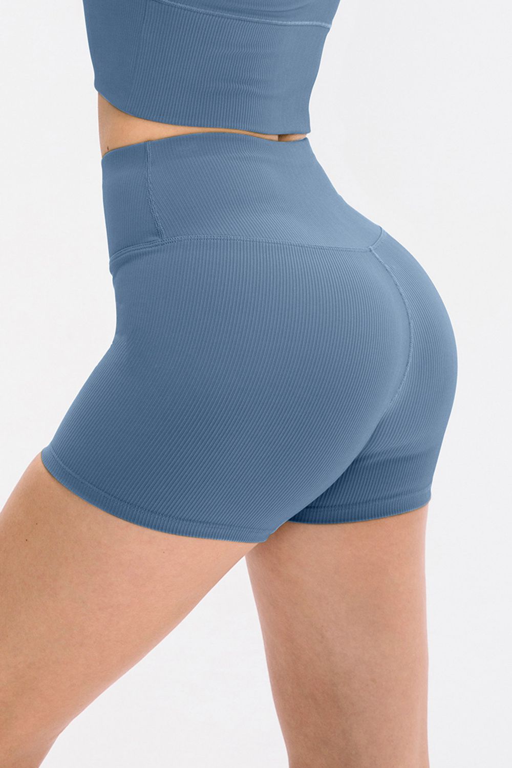 Blue athletic shorts on a white background