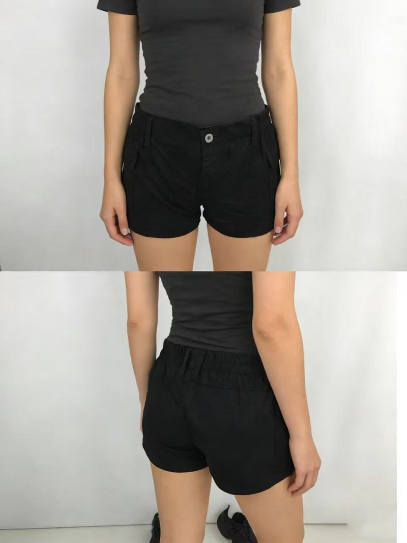 Black shorts worn by a person on a white background