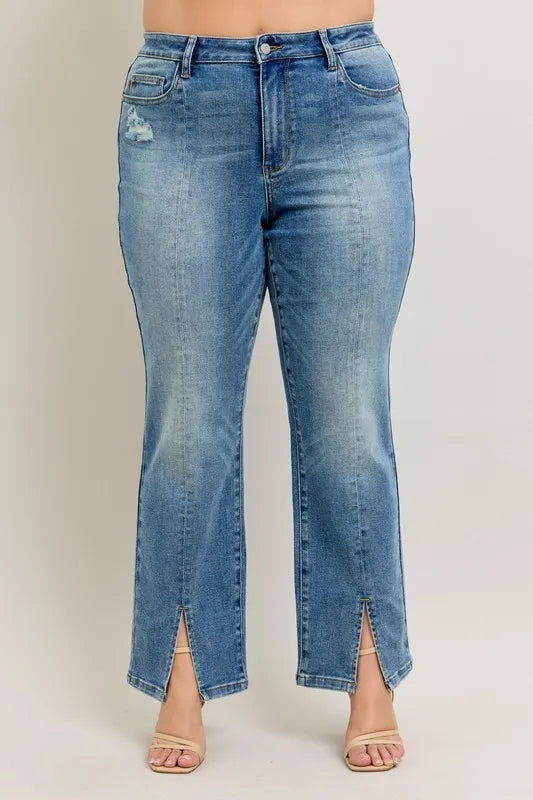 Blue jeans with a slit design on a plain background