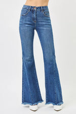 Blue flared jeans on a white background