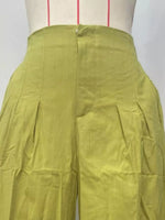 Green pants on a mannequin with a white background