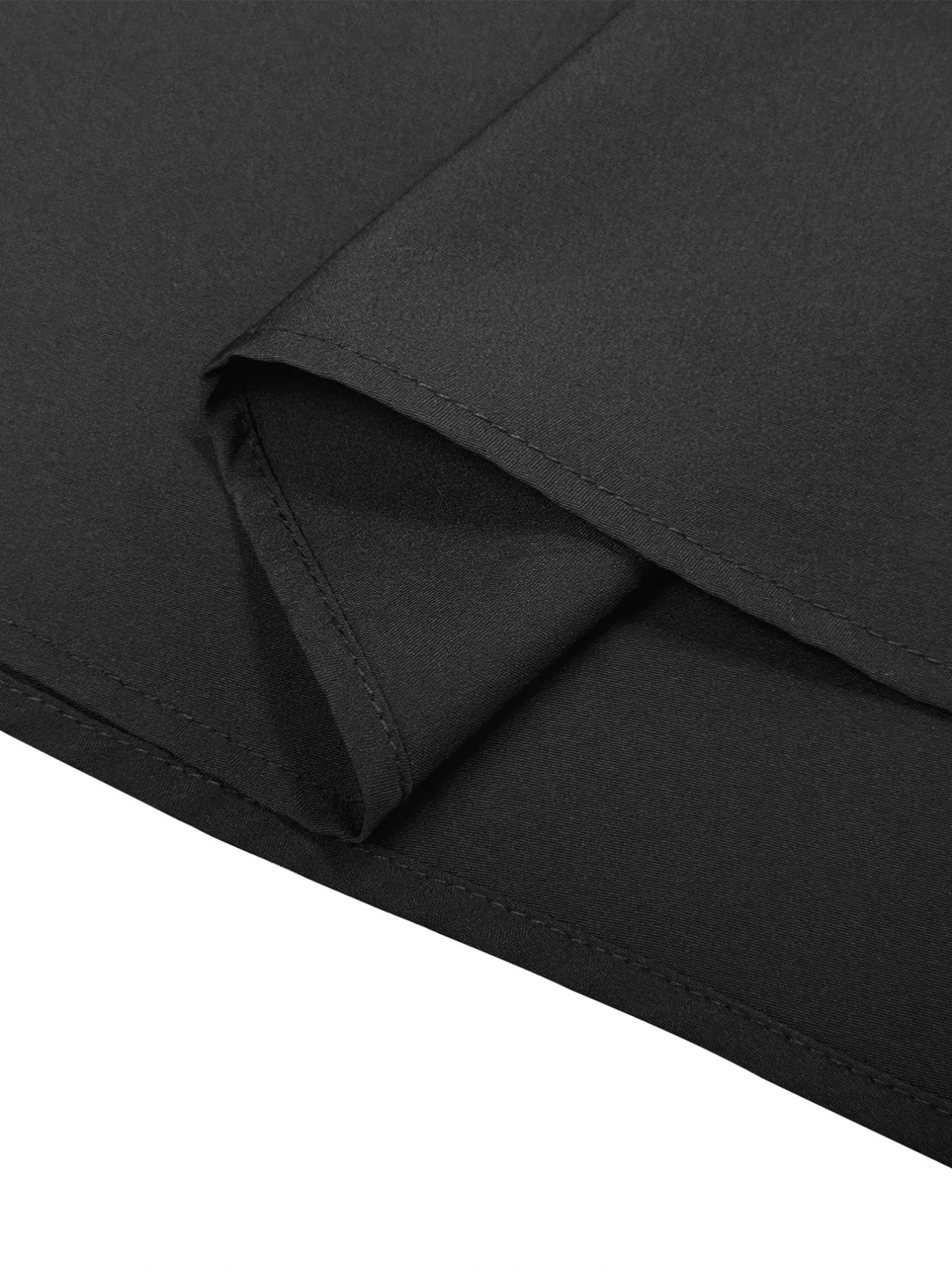 Close-up of black fabric with a slight texture on a white background