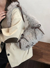 Beige trench coat with fur-lined hood and brown buttons on a wooden surface.