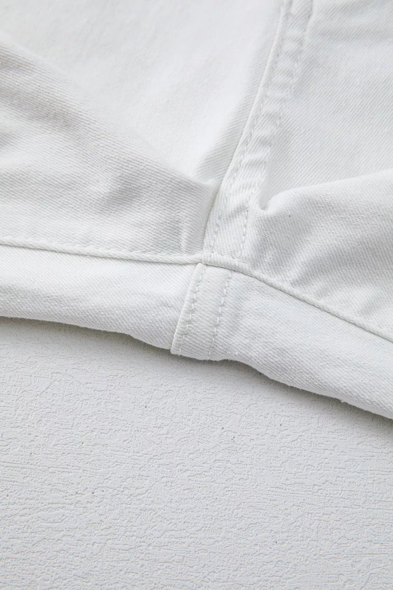 Close-up of white fabric with a focus on texture and stitching