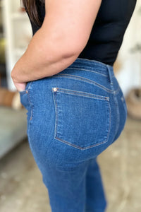 Person wearing blue jeans with a blurred background