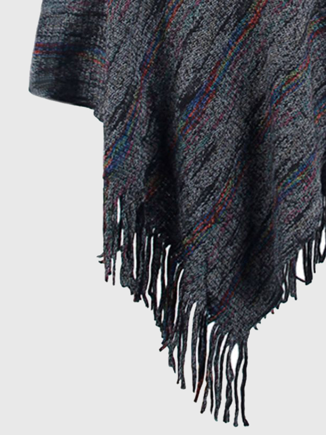 Plaid blanket with fringe edges on a light gray background